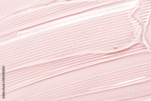 Gel texture. Pink liquid cosmetic background. Skincare serum, beauty cream with bubbles closeup