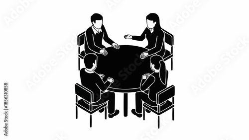 Four people in a meeting around a round table discussing ideas.