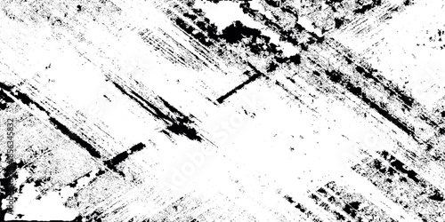 Abstract black and white textured pattern resembling brushstrokes or distressed surface with irregular lines and shapes