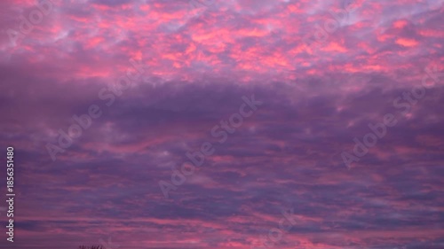 Soft Pink and Violet Cloudy Evening Sky Background With Dramatic Texture