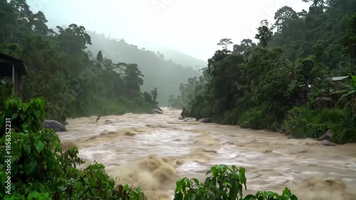 Muddy River Swollen by Stormy Weather in Mountainous Forest