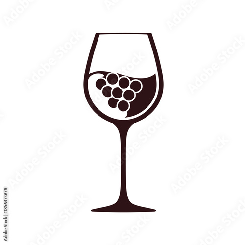 Elegant wine glass filled with grapes on display