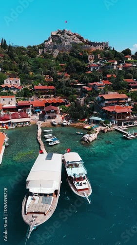Aerial view of Kaleköy (Simena), a historic coastal village with its ancient Simena Castle overlooking the bay in Antalya, Turkey.