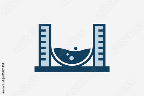 Scientific Measurement Setup with Liquid in Beaker Between Graduated Cylinders