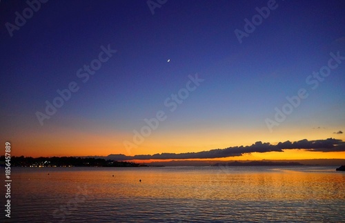 View of a colorful sunset from the shore of Glyfada, Athens, Greece
