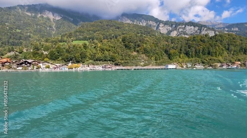 Wallpaper Mural Scenic view of Brienz village from Brienz lake, turquoise water and traditional chalets under alpine mountains. View from boat Torontodigital.ca