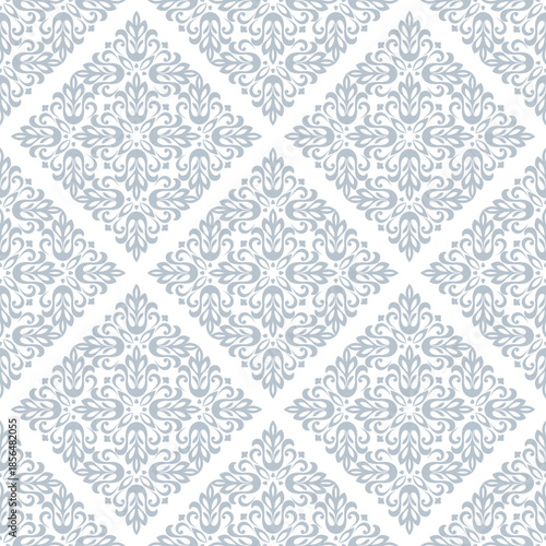 Wallpaper in the style of Baroque. White and gray floral ornament. Seamless vector background. Graphic pattern for fabric, wallpaper, packaging. Ornate Damask flower illustration