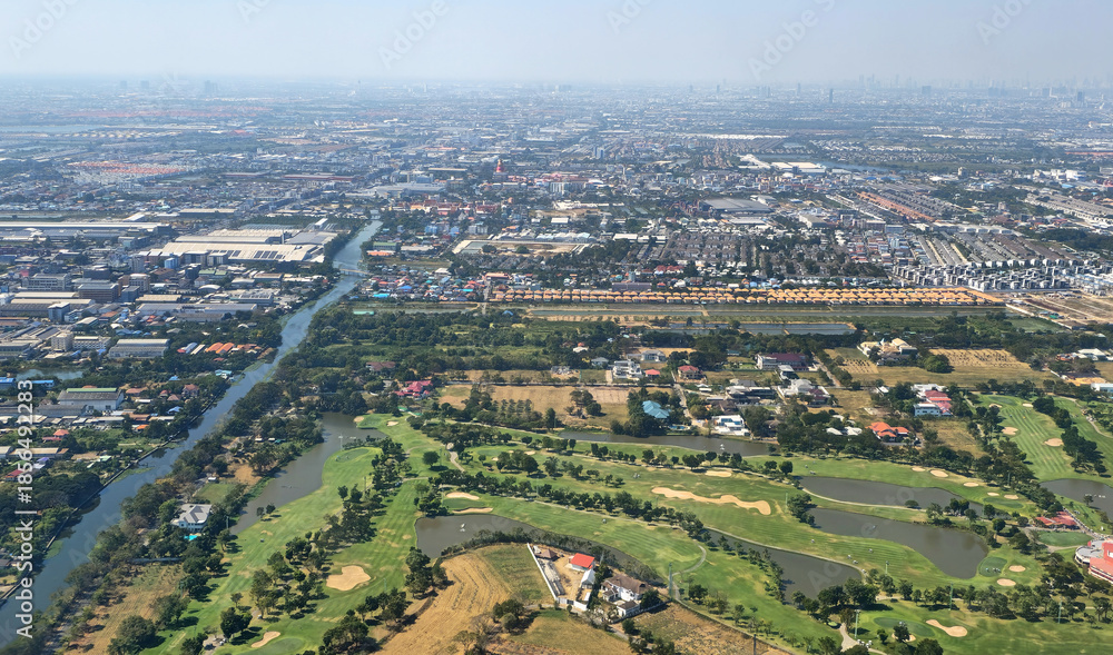 Fototapeta premium Aerial view of Bang Phli cityscape and Samrong River in Samut Prakan, Thailand, Southeast Asia.