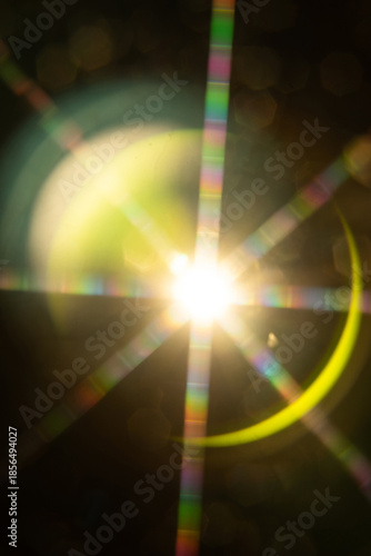 Abstract sun flare. The lens flare is subject to digital correction