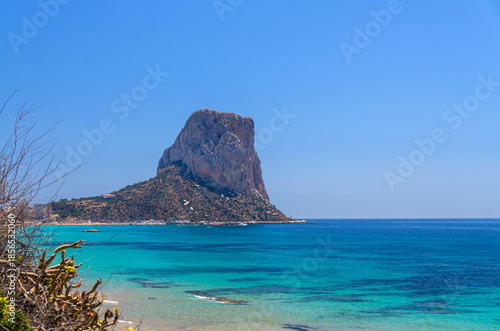 Penyal d'Ifac Natural Park rock Penon Ifach, city Calpe aerial view Costa Blanca coast, Ensenada de Calpe, Calpe bay Mediterranean Sea, azure water in sunny summer day, Valencian Community, Spain
