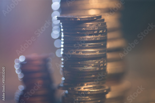 Stack of British Pound Coins with Bokeh Lighting