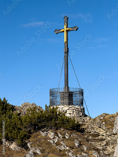Chiemgau as a Bavarian Region with a beautiful summit cross peak view and a true hike destination 