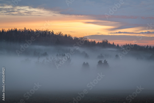 Winter sunset with inversion fog from valleys in Nemci village