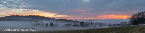 Winter sunset with inversion fog from valleys in Nemci village