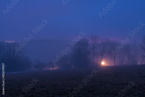 Winter blue hour after sunset with inversion fog near Cereniste village