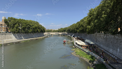 Tiber River with Summer Cafés and Tree-Lined Banks in Rome, Italy