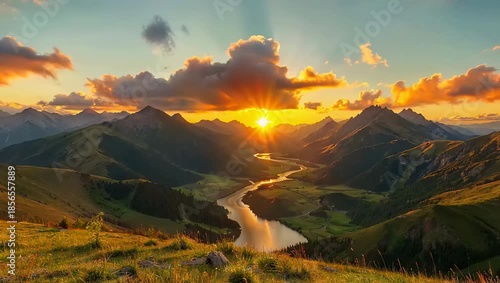 Scenic River Valley Bathed in Golden Sunrise Light with Dramatic Clouds and Mountain Peaks