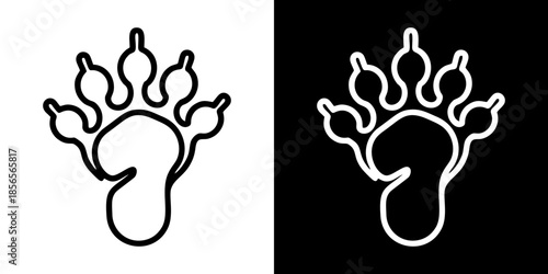 Black and white contrasting paw prints symbolizing wild animal tracks and nature's imprint on the earth