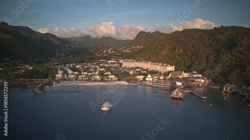 Drone hyperlapse semi orbit revealing Saint Vincent and the Grenadines coastline with tropical water and resort landscape.