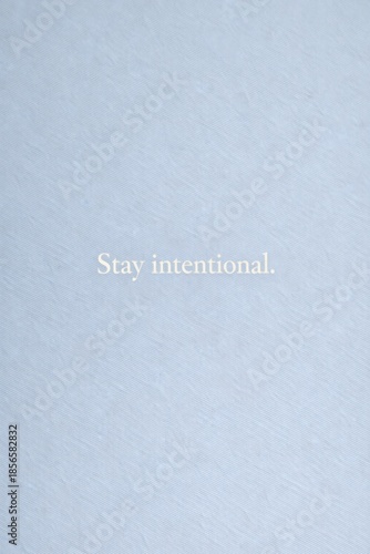 Minimalist motivational quote typography on neutral textured background