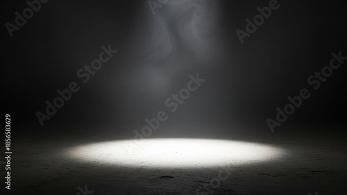 Dramatic spotlight illumination on dark stage background