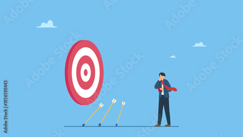 Businessman holding book look at missed target arrow learning or studying mistakes. Learn from failure or mistake, admit and embrace the failure and practice to achieve success next time.