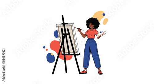 Talented female artist with an afro focuses on her painting at an easel while holding a palette of vibrant colors in a studio setting.