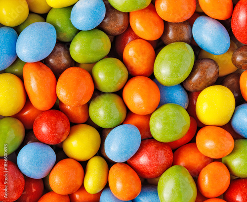 Billede på lærred Colorful candy background with sugar coated treats