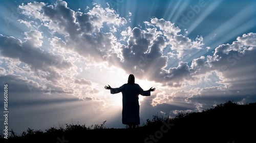 Silhouetted figure embracing divine light with arms outstretched