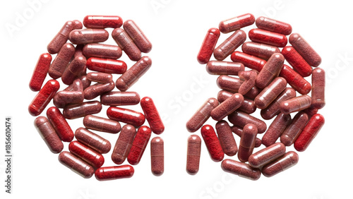 Red capsules arranged in the shape of human lungs isolated on white background, concept for lung health, respiratory supplements, and medical treatment