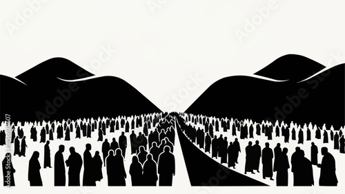 Large crowd of people walking on a road between mountains.