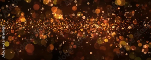Beautiful horizontal banner with a bokeh effect in golden colors on a black background