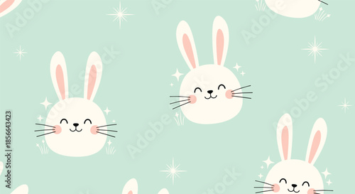 Adorable seamless pattern of cute and happy sparkling bunny faces against a lovely pastel mint green background for nursery decor.