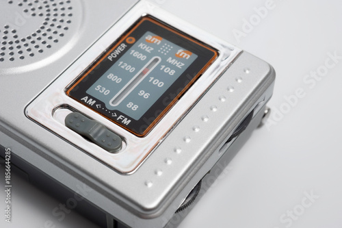 Portable battery-powered AM/FM radio photographed against a white background.