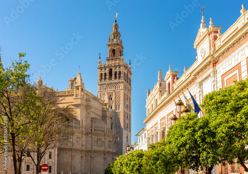 Giralda tower of Seville cathedral on Triumph square, Spain
