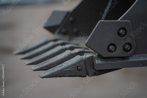 Valokuva Industrial excavator bucket teeth detail with reinforced steel points and bolts,