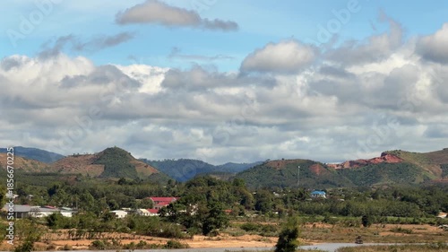 Expansive rural terrain shifts gently with the vehicle motion, slow movement turning farmland into a relaxed visual journey. Land and motion.