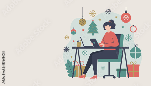 Woman working on a laptop at a decorated desk balancing business and the festive holiday season