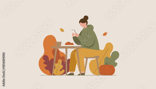 Woman uses smartphone at outdoor table enjoying coffee and leisure in a cozy autumn setting