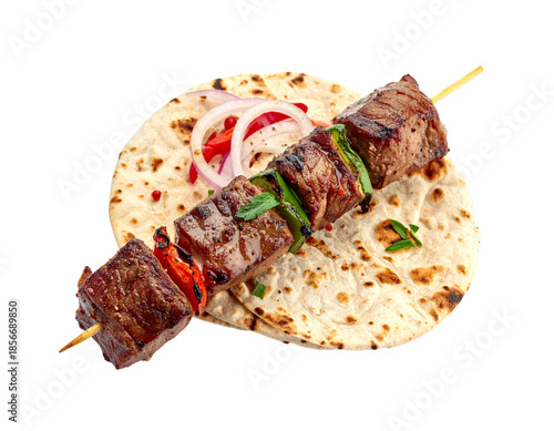 Delicious Beef Kebab Skewer Served on Warm Flatbread with Onions.