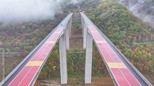 Aerial View of Viaduct over the Autumn Colorful Valley