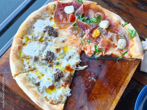 Top view of two side pizza Truffle and mushroom, Sliced ​​pork. Italian food on the table