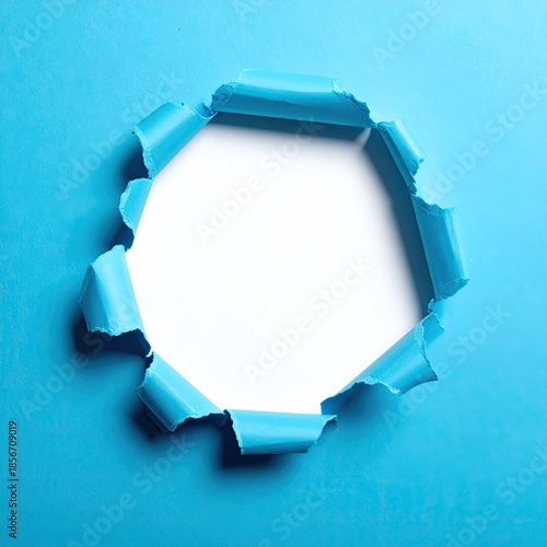 A vibrant, light-blue background with a circular hole torn through it
