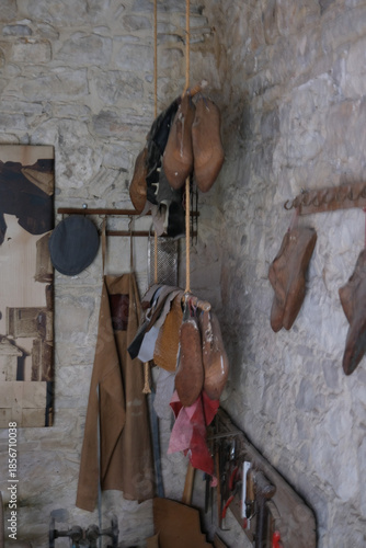 Traditional Leather Shoes Hanging on Workshop Wall
