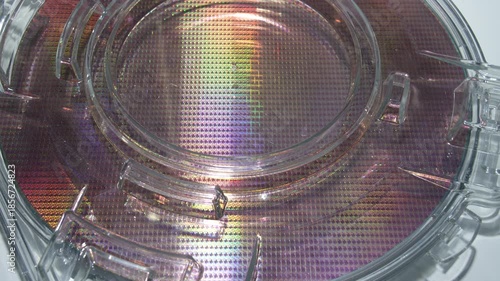 silicon wafers in a universal pod. Electronic circuit designs have been built onto the wafers using micromaching including photolithography
