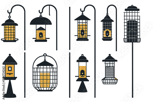 Variety of bird feeders illuminated at night
