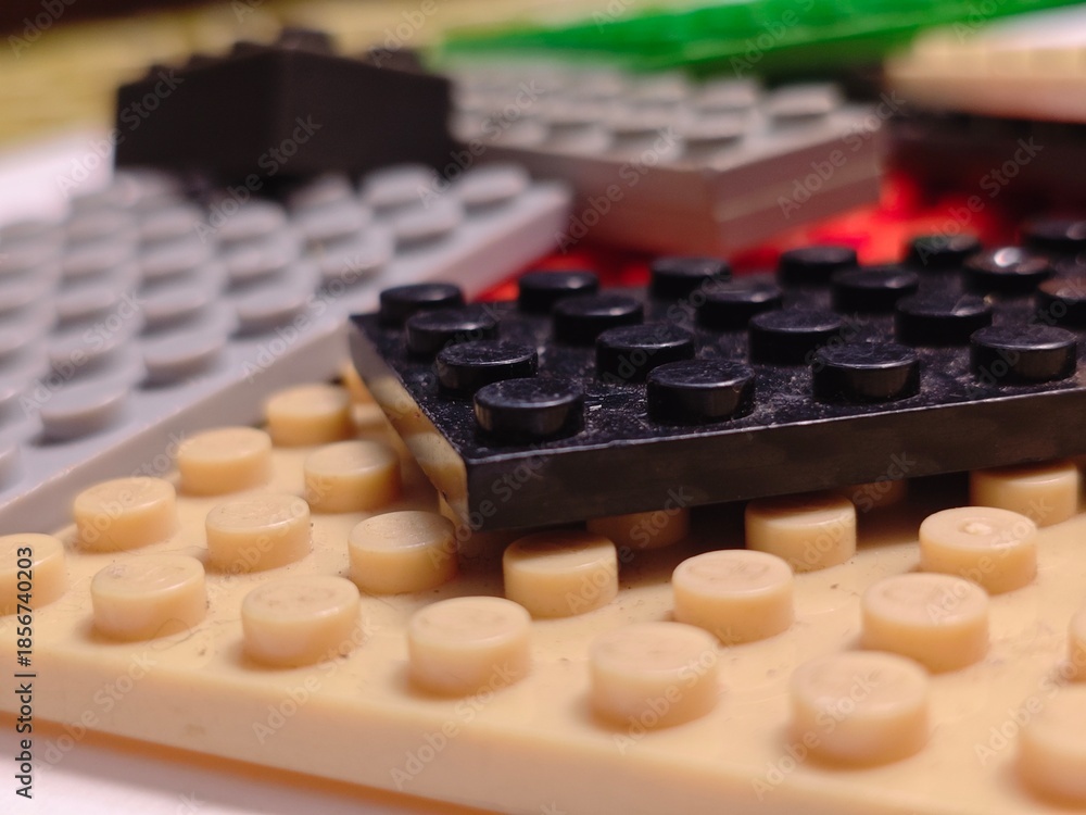 Fototapeta premium Bricks Closeup with Black and Beige Blocks.