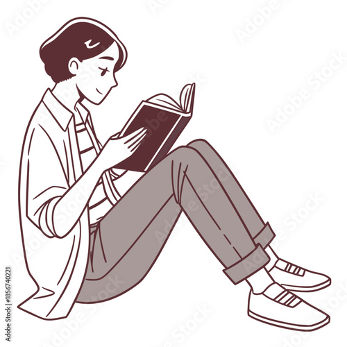 A young person is peacefully engrossed in reading a book while sitting comfortably with legs crossed