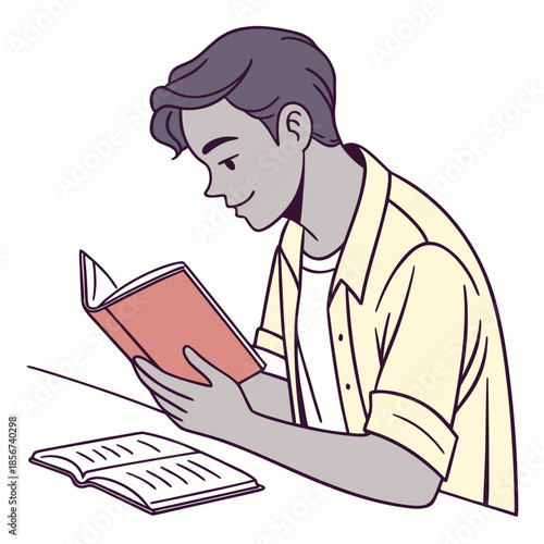 A young man absorbed in reading a book with another open book nearby suggesting focused study