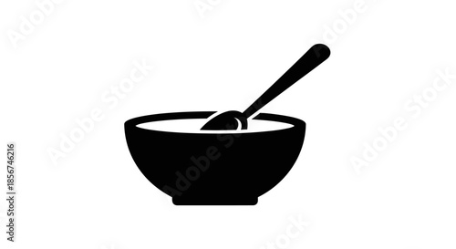 Black bowl with spoon inside.